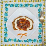 Carrot cake bread with cream cheese frosting and topped with carrot cake jam